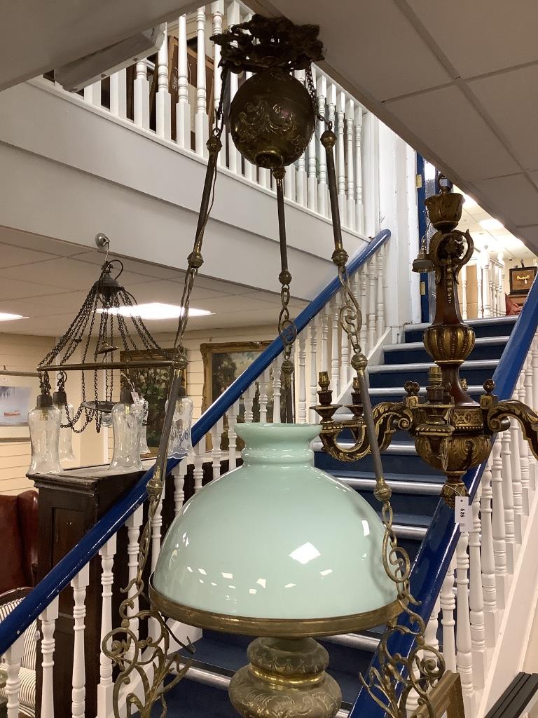 An early 20th century brass hanging oil lamp, drop 85cm